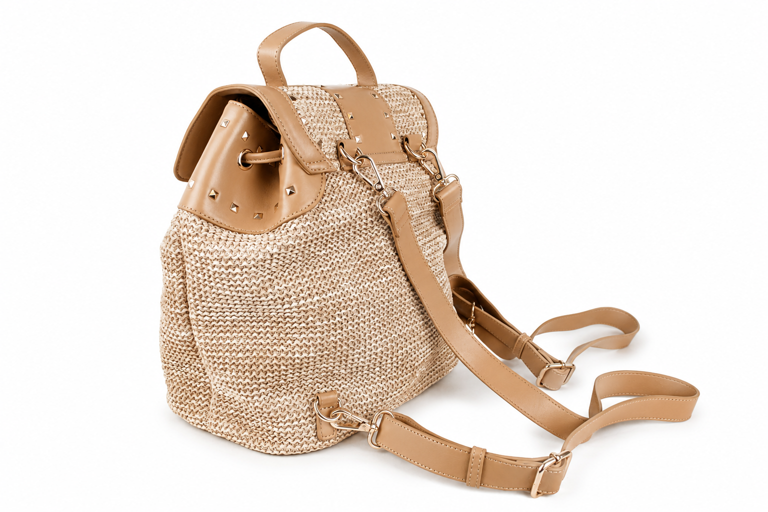 A beige woven straw backpack with tan leather trim, top handle, and adjustable shoulder strap, shown on a plain white background.