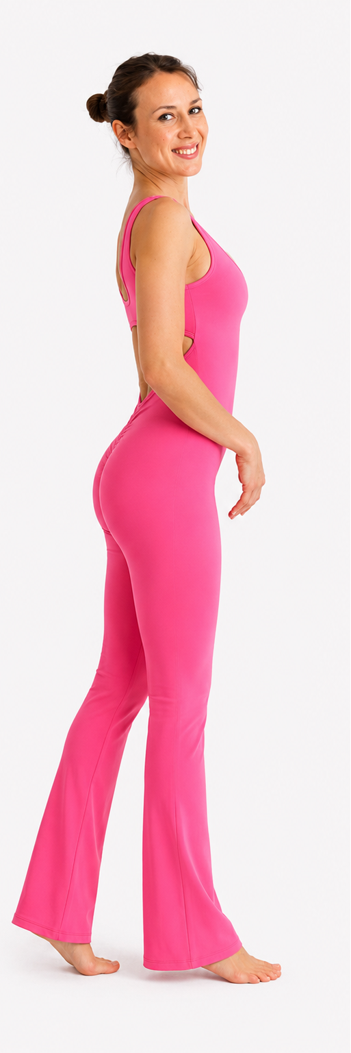 Woman wearing a bright pink jumpsuit on a white background